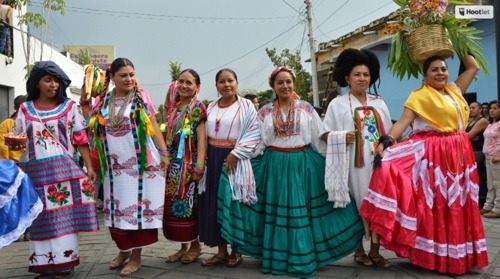 Oaxacan culture is continually celebrated. Teachers pos in traditional regional dress from some of Oaxaca's 8 regions.
