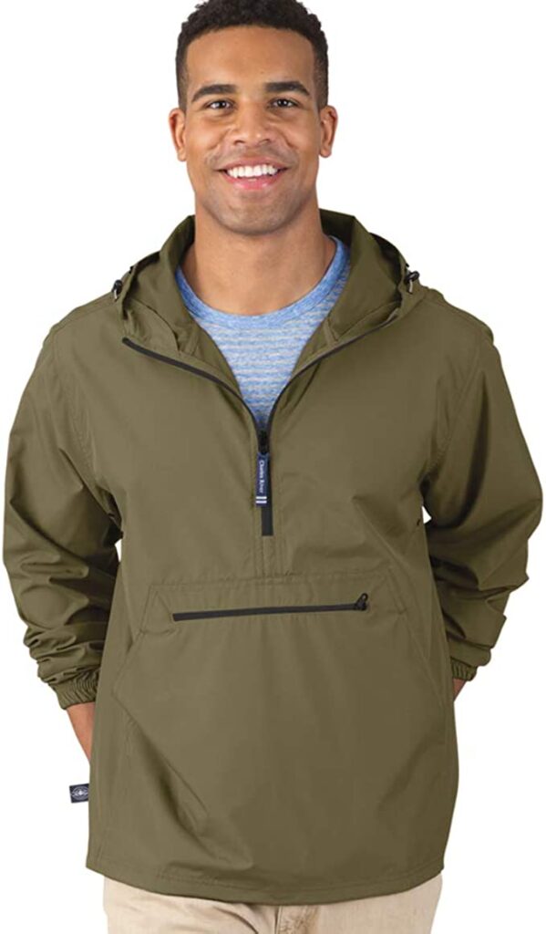 Gorpcore clothing young man wearing all-weather jacket